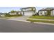 Two story house with a large grassy yard and palm trees at 12409 Wigeon Dr, Bradenton, FL 34212