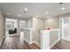 Upstairs hallway with wood-look floors and access to bedrooms and a bathroom at 12409 Wigeon Dr, Bradenton, FL 34212