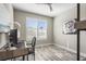 Bright home office features wood-look floors, built-in shelving, and plenty of natural light at 12409 Wigeon Dr, Bradenton, FL 34212