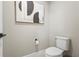 Stylish powder room featuring a contemporary toilet and art at 12409 Wigeon Dr, Bradenton, FL 34212