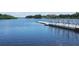 Calm river view featuring a dock and distant home at 12409 Wigeon Dr, Bradenton, FL 34212