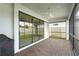 Relaxing screened porch with paver patio and sliding glass doors at 12409 Wigeon Dr, Bradenton, FL 34212