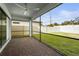 Spacious screened porch with paver patio and backyard view at 12409 Wigeon Dr, Bradenton, FL 34212