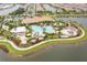 Resort-style pool and spa with expansive deck and landscaping at 12410 Osorio Ct # 103, Sarasota, FL 34238