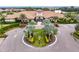 Community clubhouse entrance with circular driveway and landscaping at 12410 Osorio Ct # 103, Sarasota, FL 34238