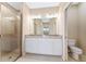 Clean bathroom with double vanity and tiled shower at 12410 Osorio Ct # 103, Sarasota, FL 34238