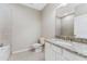 Bathroom with granite countertop vanity and tiled floors at 12410 Osorio Ct # 103, Sarasota, FL 34238