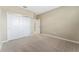 Spacious bedroom with double door closet and carpeted floor at 12410 Osorio Ct # 103, Sarasota, FL 34238