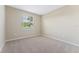 Bright bedroom with neutral walls and carpeted floors at 12410 Osorio Ct # 103, Sarasota, FL 34238