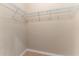 Bright walk-in closet with wire shelving at 12410 Osorio Ct # 103, Sarasota, FL 34238