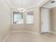 Light-filled dining area with neutral walls and tile flooring at 12410 Osorio Ct # 103, Sarasota, FL 34238