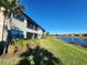 Building exterior showcasing a water view and landscaping at 12410 Osorio Ct # 103, Sarasota, FL 34238