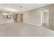 Open concept living room with tile flooring and neutral walls at 12410 Osorio Ct # 103, Sarasota, FL 34238