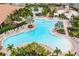 Relaxing resort-style pool with multiple areas for lounging and swimming at 12410 Osorio Ct # 103, Sarasota, FL 34238