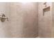 Large tiled shower with neutral tones and modern fixtures at 12410 Osorio Ct # 103, Sarasota, FL 34238