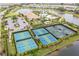 Community tennis and pickleball courts with ample parking at 12410 Osorio Ct # 103, Sarasota, FL 34238