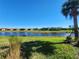 Scenic waterfront view of homes and lush landscape at 12410 Osorio Ct # 103, Sarasota, FL 34238