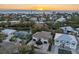 Aerial perspective of the house, showcasing its position within a residential area near the ocean at 127 Crescent Dr, Anna Maria, FL 34216