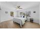 Spacious bedroom with light hardwood floors and large windows at 127 Crescent Dr, Anna Maria, FL 34216