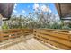 Elevated wooden deck with railing and scenic view at 127 Crescent Dr, Anna Maria, FL 34216