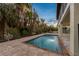 Relaxing rectangular pool with a patio at 127 Crescent Dr, Anna Maria, FL 34216