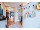 Interior view of the entryway with white shiplap and a decorative shelf at 13153 Steinhatchee Loop, Venice, FL 34293