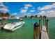 Boat docked at a marina with calm waters at 13153 Steinhatchee Loop, Venice, FL 34293