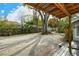 Gravel backyard with mature trees and wooden structure at 1320 Cocoanut Ave, Sarasota, FL 34236