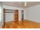 Bedroom with hardwood floors, closet, and ceiling fan at 1320 Cocoanut Ave, Sarasota, FL 34236