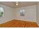 Spacious bedroom with hardwood floors and window at 1320 Cocoanut Ave, Sarasota, FL 34236