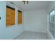 Bonus room with tile floors and wood shutters at 1320 Cocoanut Ave, Sarasota, FL 34236