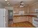 Kitchen with light wood cabinets and terracotta tile floors at 1320 Cocoanut Ave, Sarasota, FL 34236