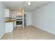 Efficient kitchen with white cabinets and tile floor at 1320 Cocoanut Ave, Sarasota, FL 34236