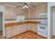 Efficient kitchen featuring light wood cabinets and appliances at 1320 Cocoanut Ave, Sarasota, FL 34236