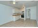 Small kitchen with white cabinets and tile floor at 1320 Cocoanut Ave, Sarasota, FL 34236