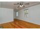 Bright living room with hardwood floors and two windows at 1320 Cocoanut Ave, Sarasota, FL 34236