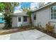 Small patio area with mature landscaping at 1320 Cocoanut Ave, Sarasota, FL 34236