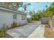 Small concrete patio area with wooden fence at 1320 Cocoanut Ave, Sarasota, FL 34236