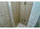 Simple shower stall with beige tile walls at 1320 Cocoanut Ave, Sarasota, FL 34236