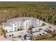 Aerial view of building and waterfront property at 14191 Heritage Landing Blvd # 1244, Punta Gorda, FL 33955