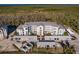 Aerial view of apartment building with parking and surrounding landscape at 14191 Heritage Landing Blvd # 1244, Punta Gorda, FL 33955
