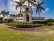 Heritage Landing community entrance sign with landscaping at 14191 Heritage Landing Blvd # 1244, Punta Gorda, FL 33955