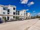 Building exterior with covered parking spaces and landscaping at 14191 Heritage Landing Blvd # 1244, Punta Gorda, FL 33955