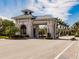 Gated entrance to a community with palm trees at 14191 Heritage Landing Blvd # 1244, Punta Gorda, FL 33955