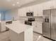 Modern kitchen with stainless steel appliances and an island at 14191 Heritage Landing Blvd # 1244, Punta Gorda, FL 33955