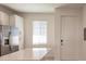 Bright kitchen with white cabinets, stainless steel appliances, and an island at 14191 Heritage Landing Blvd # 1244, Punta Gorda, FL 33955