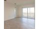 Living room with sliding doors leading to a balcony and scenic views at 14191 Heritage Landing Blvd # 1244, Punta Gorda, FL 33955
