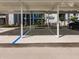 Covered parking spaces available with building in background at 14191 Heritage Landing Blvd # 1244, Punta Gorda, FL 33955