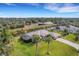 Lovely canal-front home with lush landscaping and tropical trees at 1572 Nimbus Dr, North Port, FL 34287