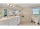 Relaxing bathroom featuring a garden tub and updated fixtures at 1572 Nimbus Dr, North Port, FL 34287